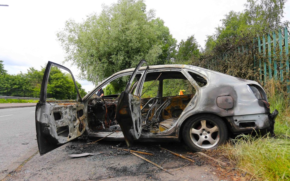 Saturday 28th June 2014 - Belfast Northern Ireland

A stolen car pictured burnt out  in the Poleglass estate following a night of "Joy Riding" on a major scale 

Picture - Kevin Scott